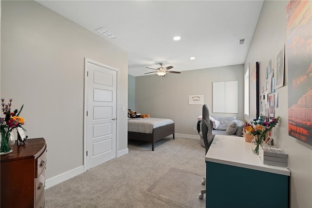 bedroom with visible vents, baseboards, and light colored carpet