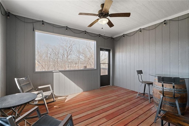 wooden deck with ceiling fan