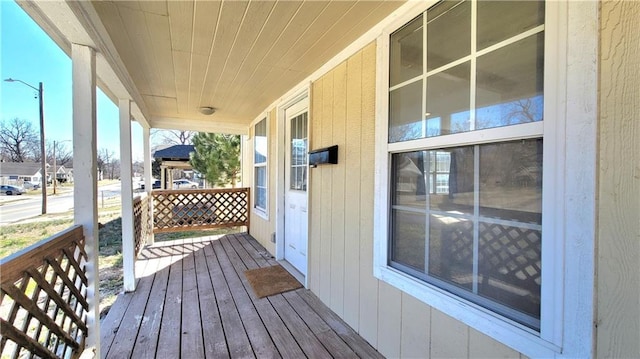 wooden deck featuring covered porch