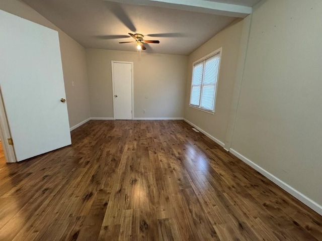 empty room with dark wood-type flooring, baseboards, and ceiling fan