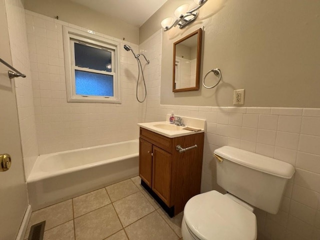 bathroom with tile walls, shower / washtub combination, toilet, tile patterned floors, and vanity