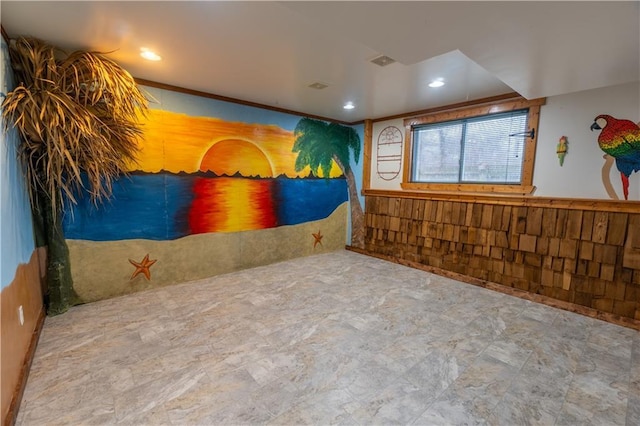 misc room with wainscoting, wooden walls, and recessed lighting