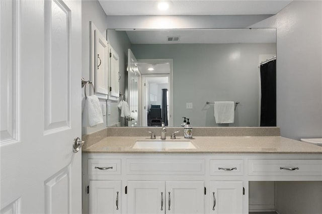 full bathroom with visible vents and vanity