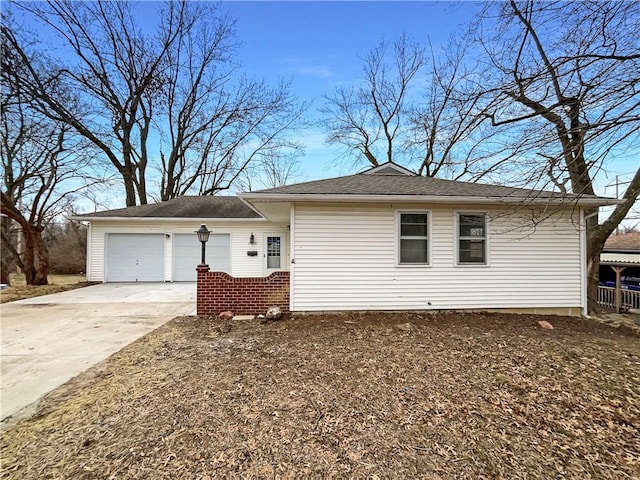 single story home with an attached garage and driveway