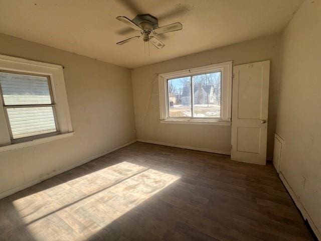 unfurnished room featuring wood finished floors and a ceiling fan