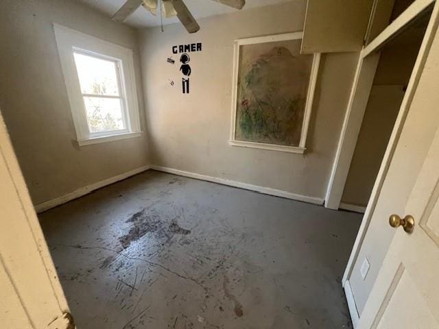 unfurnished bedroom featuring unfinished concrete flooring and baseboards