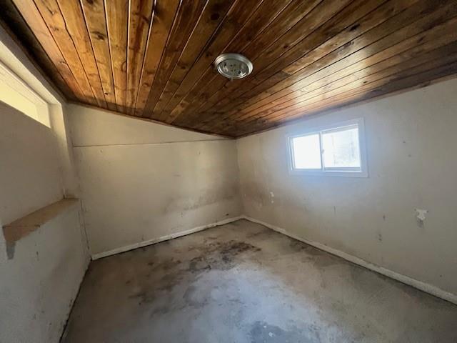 basement featuring wooden ceiling