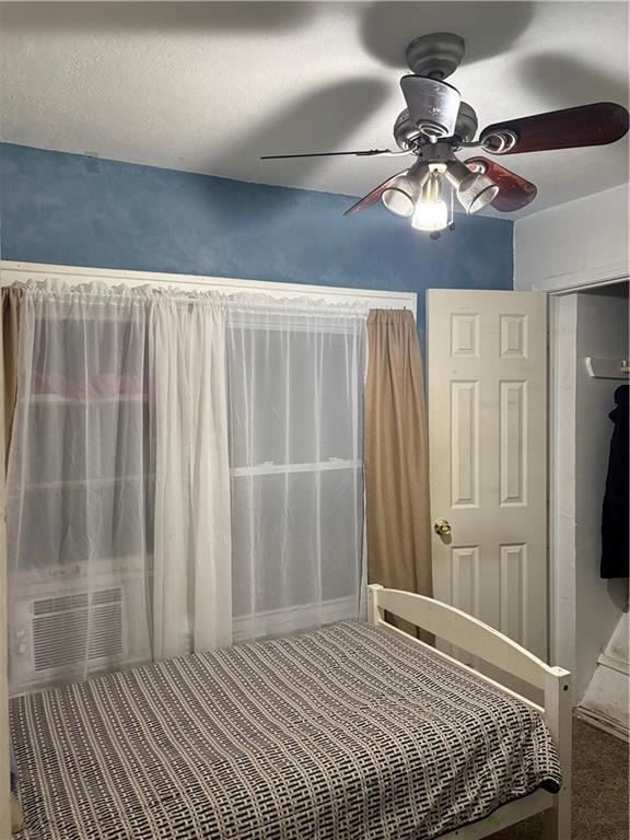 unfurnished bedroom with a ceiling fan