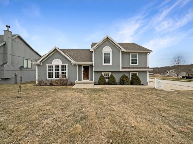 split level home with a front yard