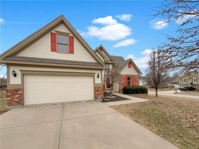 view of front of home featuring brick siding and concrete driveway