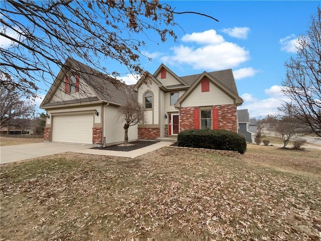 view of front facade with brick siding, an attached garage, and driveway