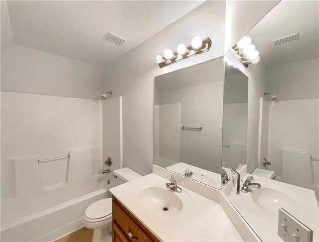 bathroom with visible vents, toilet,  shower combination, and vanity