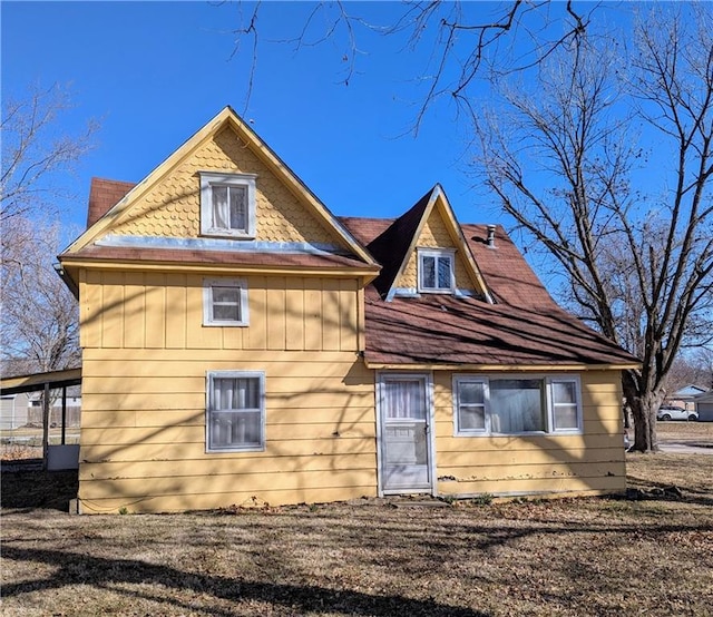 rear view of house with board and batten siding