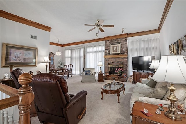 carpeted living area with visible vents, a fireplace, a ceiling fan, and ornamental molding