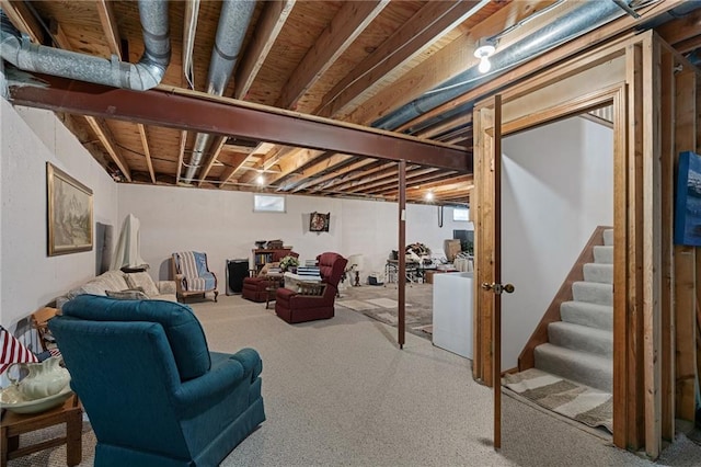 below grade area with stairway, plenty of natural light, and carpet floors