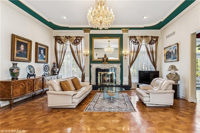 living area featuring visible vents, a notable chandelier, a high end fireplace, and crown molding