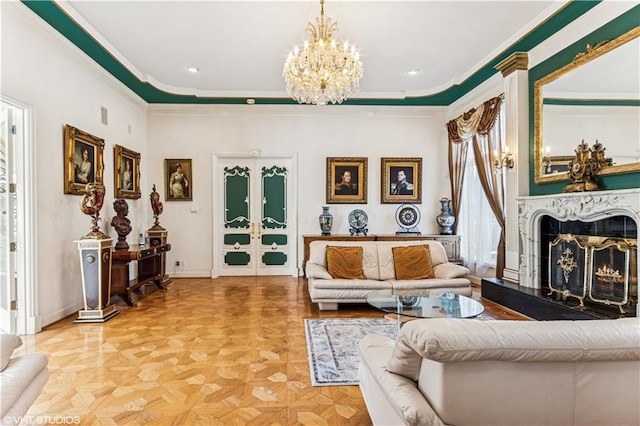 living room featuring a notable chandelier, ornamental molding, recessed lighting, a fireplace, and baseboards