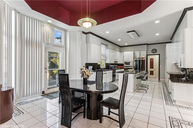 dining area featuring crown molding, light tile patterned floors, recessed lighting, and baseboards