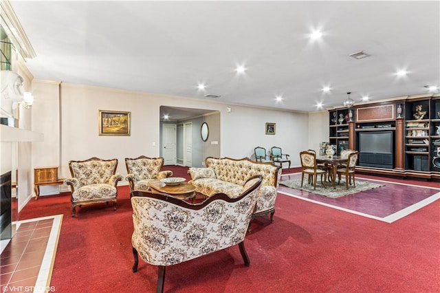 carpeted living area featuring crown molding, recessed lighting, a fireplace, and visible vents