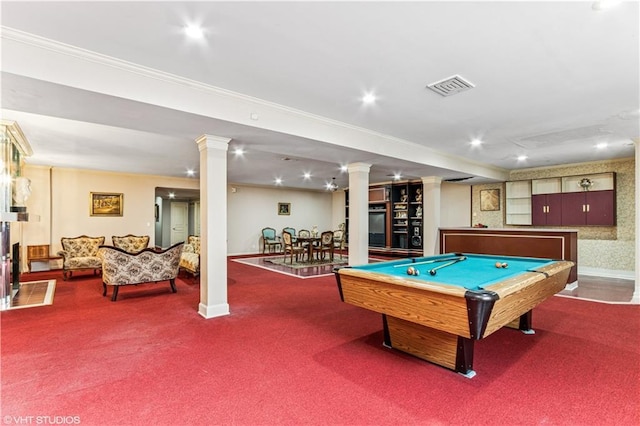 recreation room featuring visible vents, crown molding, carpet, and decorative columns