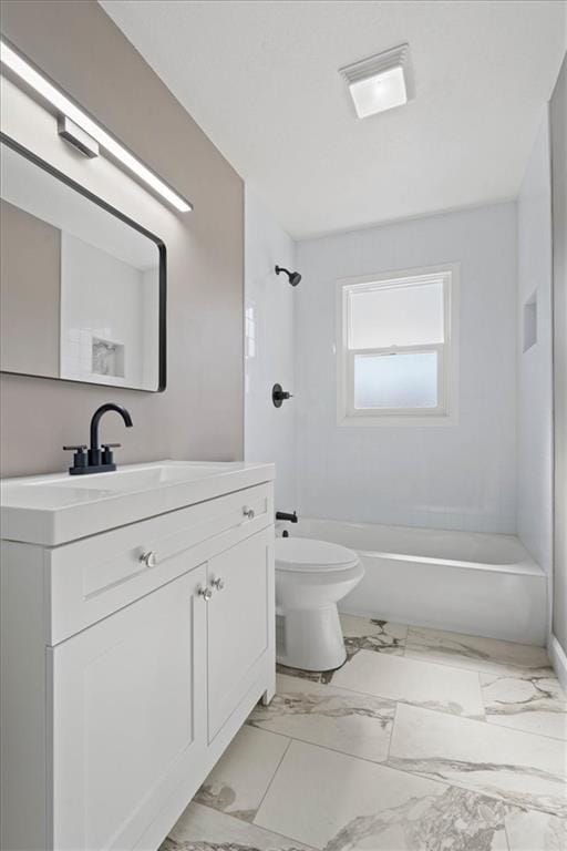 bathroom featuring tub / shower combination, toilet, marble finish floor, and vanity