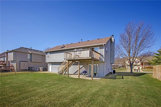 back of property with a deck, central AC, fence, stairway, and a patio area