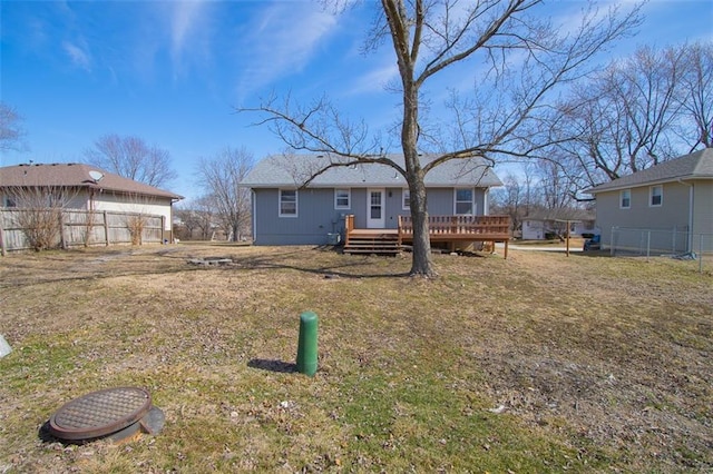 view of front of home featuring a wooden deck and fence