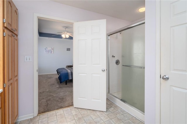 full bath with an enclosed shower, baseboards, and ceiling fan