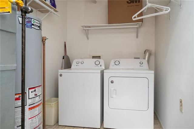 laundry room featuring gas water heater, laundry area, and washing machine and clothes dryer