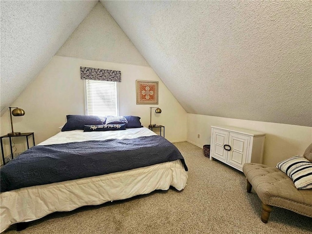 carpeted bedroom featuring a textured ceiling and lofted ceiling