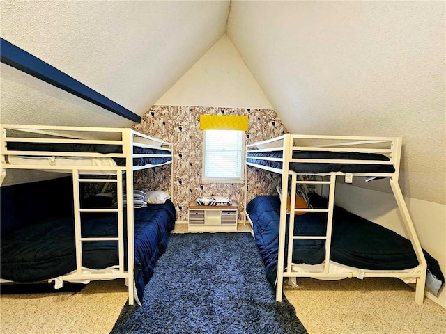 bedroom featuring carpet and lofted ceiling