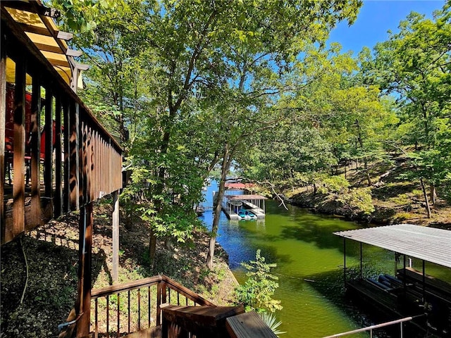 exterior space featuring a water view and a dock