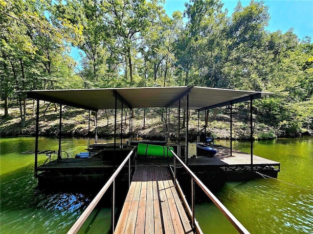 view of dock featuring boat lift and a water view