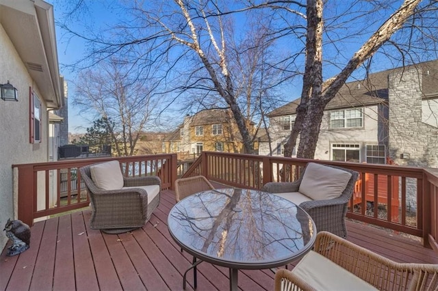 wooden terrace with outdoor dining area