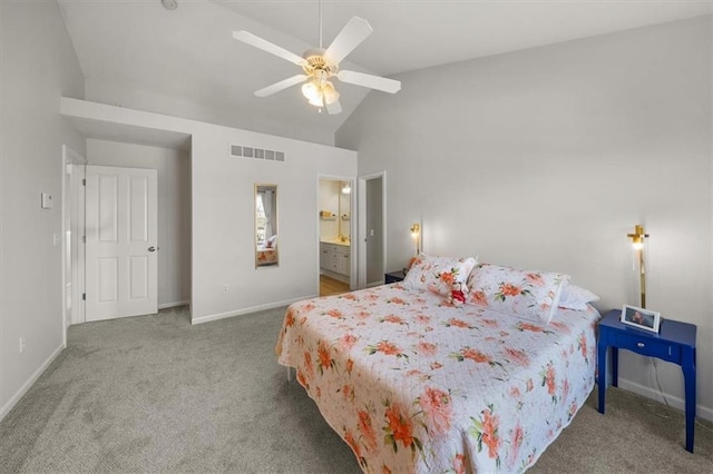 carpeted bedroom featuring visible vents, ensuite bath, baseboards, ceiling fan, and vaulted ceiling