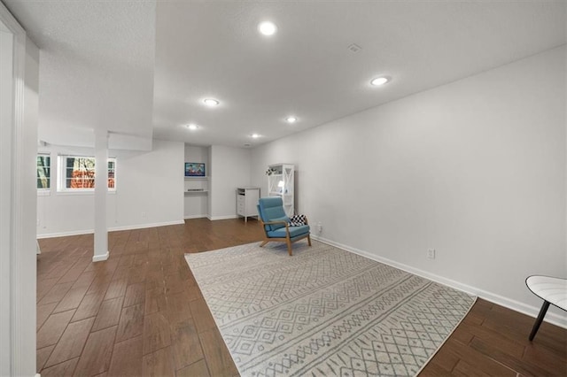 unfurnished room with recessed lighting, baseboards, and wood finished floors