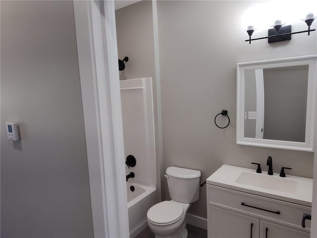 bathroom featuring vanity, shower / tub combination, and toilet