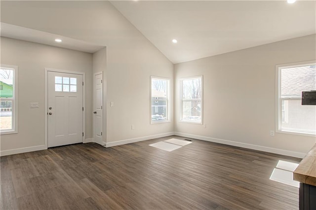 foyer entrance with recessed lighting, baseboards, dark wood-type flooring, and lofted ceiling