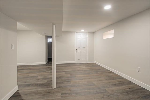 basement with dark wood-style floors, recessed lighting, and baseboards