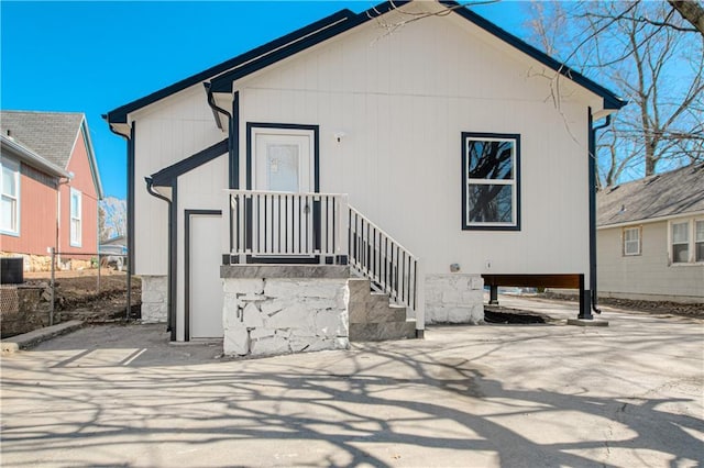 rear view of property featuring a carport