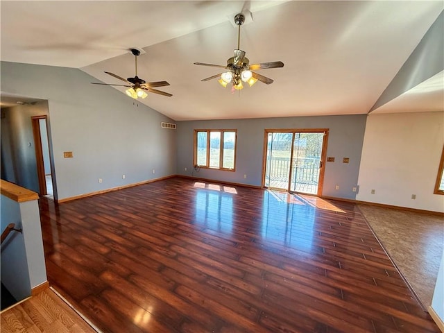 unfurnished living room with visible vents, ceiling fan, baseboards, lofted ceiling, and wood finished floors