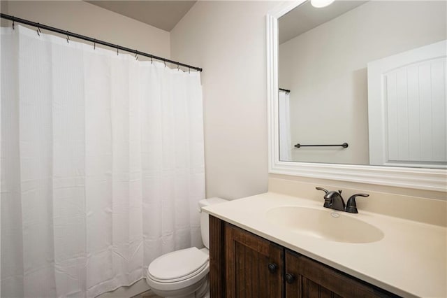 full bathroom featuring toilet and vanity