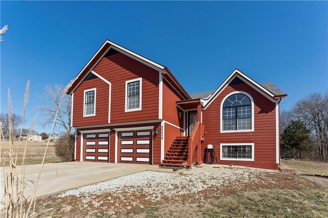 view of front of property featuring driveway and an attached garage