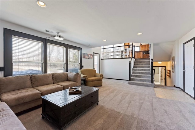 living area featuring visible vents, recessed lighting, light tile patterned floors, light colored carpet, and stairs