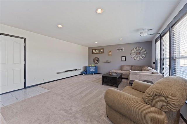 carpeted living room with tile patterned floors, recessed lighting, and baseboards