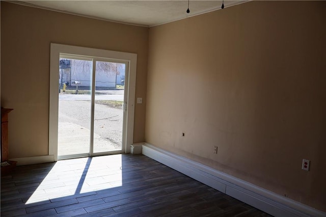 spare room with dark wood-style flooring