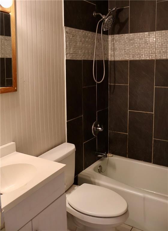 bathroom with vanity,  shower combination, and toilet