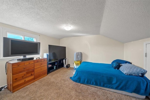 carpeted bedroom with lofted ceiling and a textured ceiling