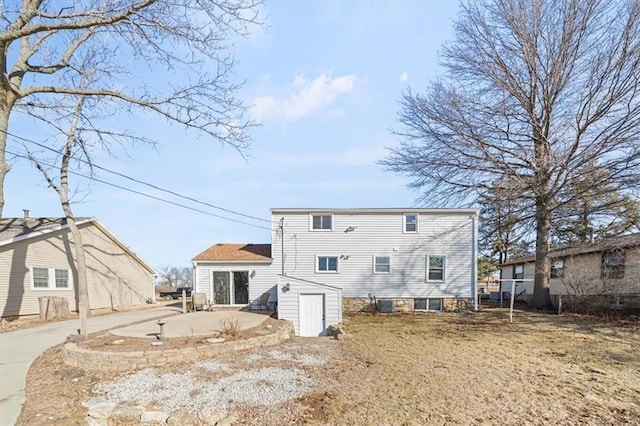 back of house with a patio area