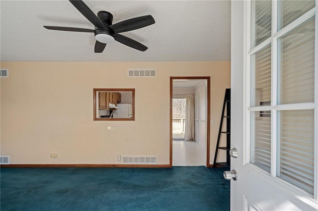 interior space with visible vents and a textured ceiling